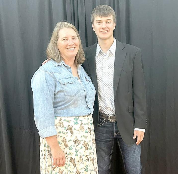 Nick Kenzy is shown here with Mrs. Mollie Andrews, who offered the curriculum for the Fed Beef Challenge program in her animal science class.