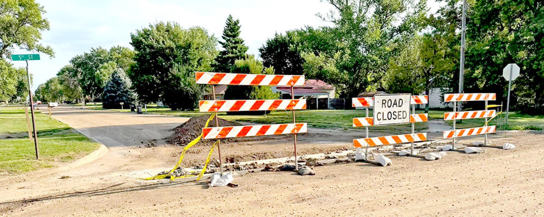 Crews are continuing road improvements, and motorists are asked to be patient and follow all barricades and traffic controls. Do not cross the yellow tape or drive around barricades while new concrete is being poured. Damaging fresh concrete can be expensive, and failing to obey a traffic control device carries a $132.50 fine.