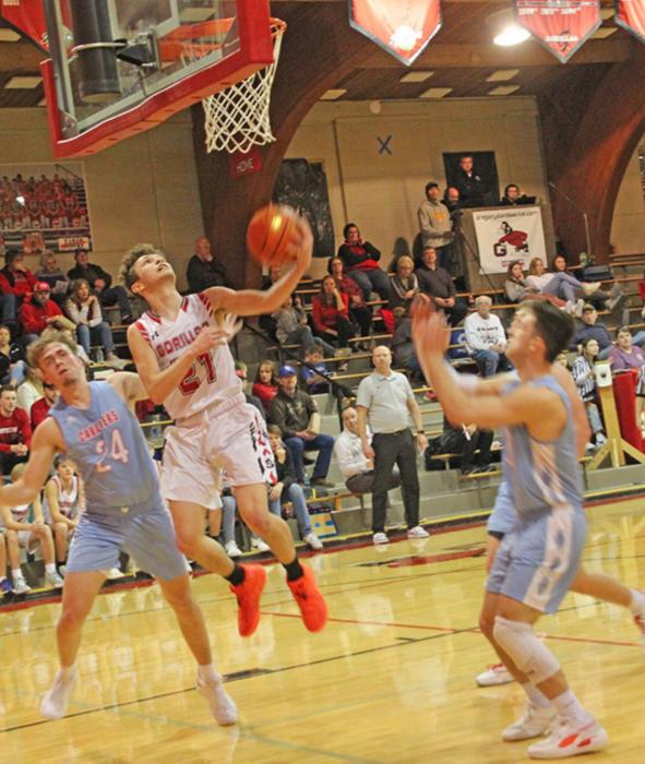 Jordan Songer goes up for two in Gregory’s win against Bon Homme on Friday. Daniel Mitchell led the team in points and rebounds for a double-double in the game.