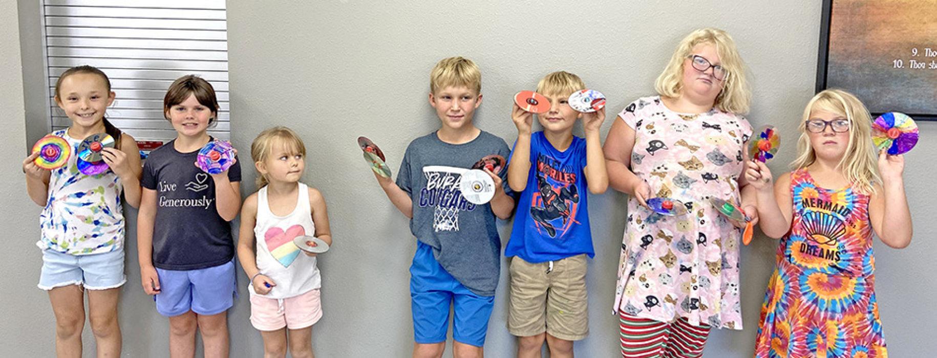 On Monday, July 10, Gregory County 4-H kids recycled old CDs in their CD crafting workshop. The youth turned old CDs into scratch art by painting them and later scratching designs into the dried paint. They also recycled CDs by making them into fun spinning tops to take home.