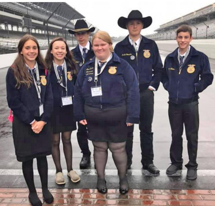 The Gregory County chapter members are shown here on the bricks at Indianapolis Speedway.