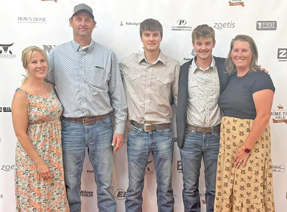 Tyler Kenzy, second from the right, was announced as the winner of the Fed Cattle Challenge. He is shown here with his family, l to r; mother Shelly Kenzy, father George Kenzy, brother Nick Kenzy, and Gregory County FFA advisor Mollie Andrews.