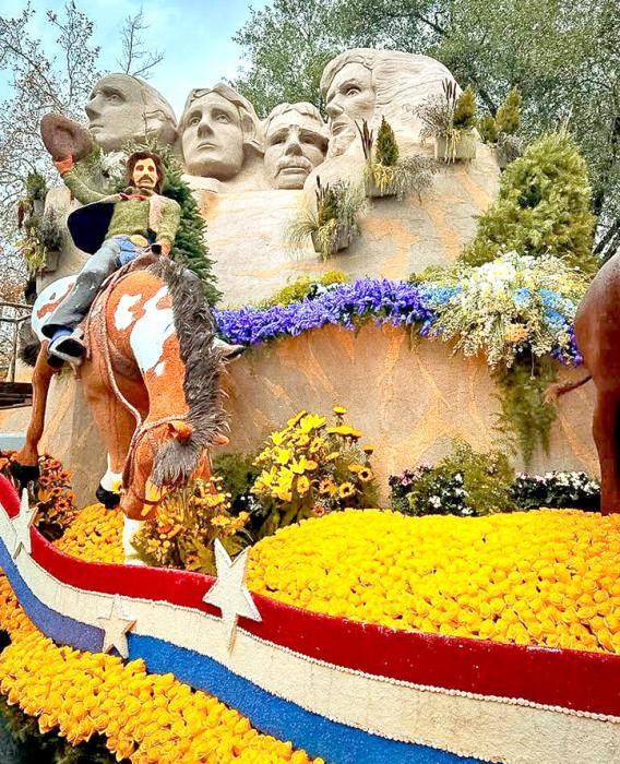 Mt. Rushmore and a bronc rider were featured on the float. (Photo taken from Travel South Dakota’s Facebook page.)
