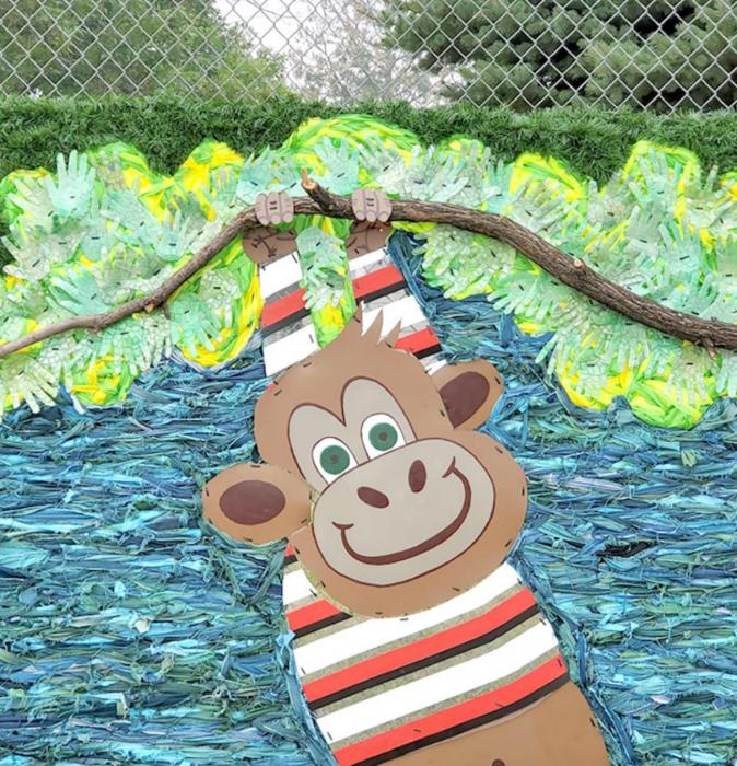 The Linking Fences art installation was completed this summer at the Gregory Day Care fence, depicting a gorilla swinging from a tree.