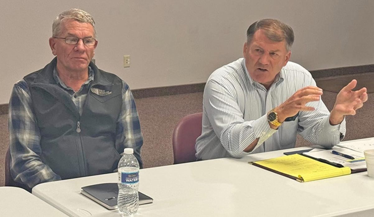 U.S. Sen. Mike Rounds, right, speaks during a meeting in Pierre, S.D., on Sept. 22, 2025, with South Dakota rowcrop farmers, including Doug Simons, left, president of the South Dakota Wheat Growers Association.