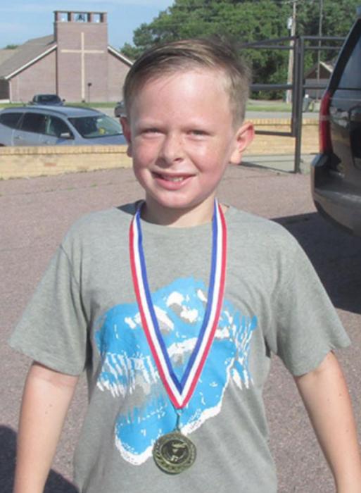 Micah Hudson, 2 mile run boys 10 and under -1st