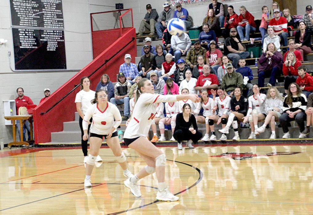 Allison Stevicks executes a successful serve reception as Raylynn Dehning keeps an eye on the ball.