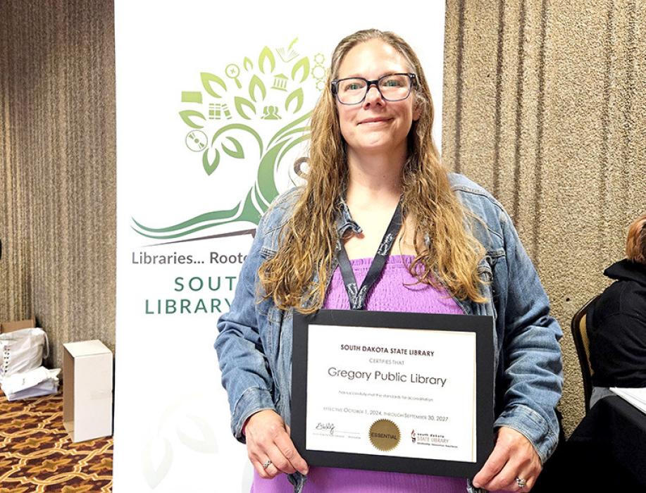 Library Director Tara Engel is shown here with the certificate of accreditation that she was awarded at the South Dakota Library Association Conference on September 26, 2024.