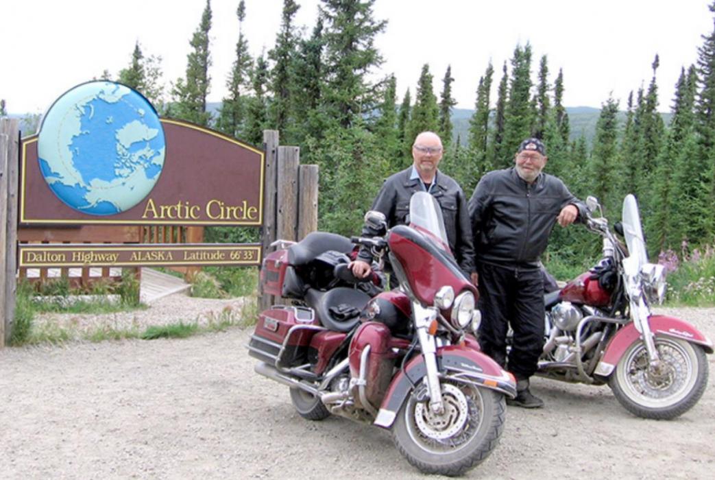 Larry and Jim braved the mosquitoes long enough to pose for a picture at the Arctic Circle.