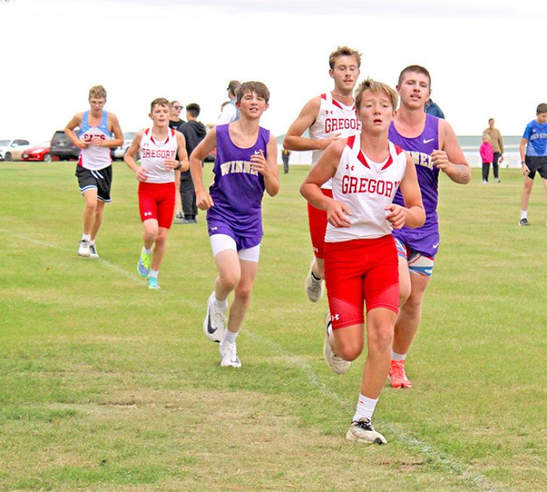 Robby Ring, Isaac Hull, AJ Lutt finished close together in the varsity race. (Photo by George Timanus)