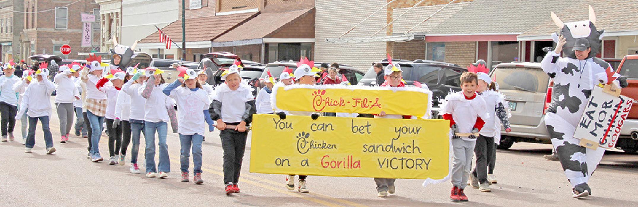 The second graders dressed like chickens for their Chick-Fil-A theme, urging people to “Eat Mor Cougars” for their winning entry in the elementary division.
