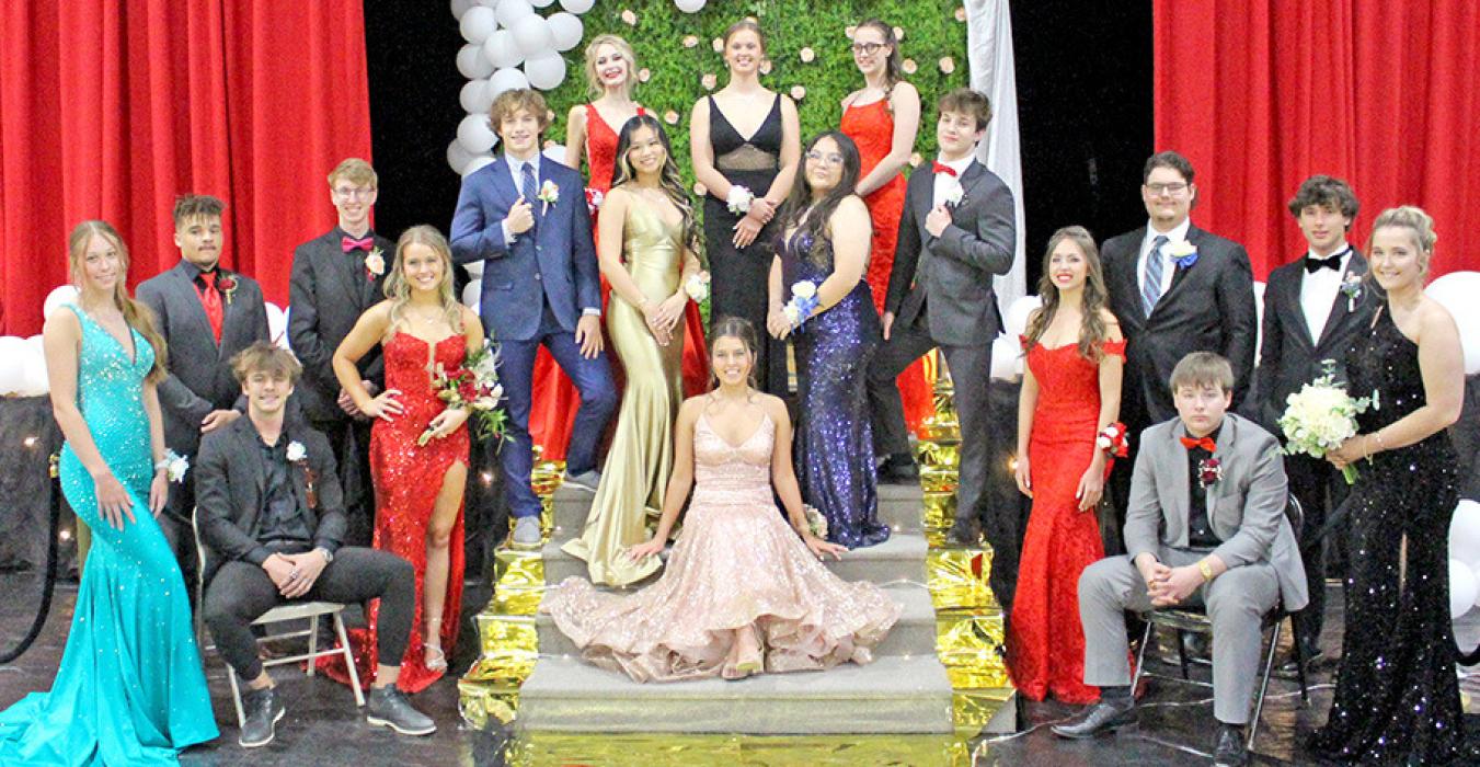 Eighteen members of the senior class gathered for a group photo for their last prom.