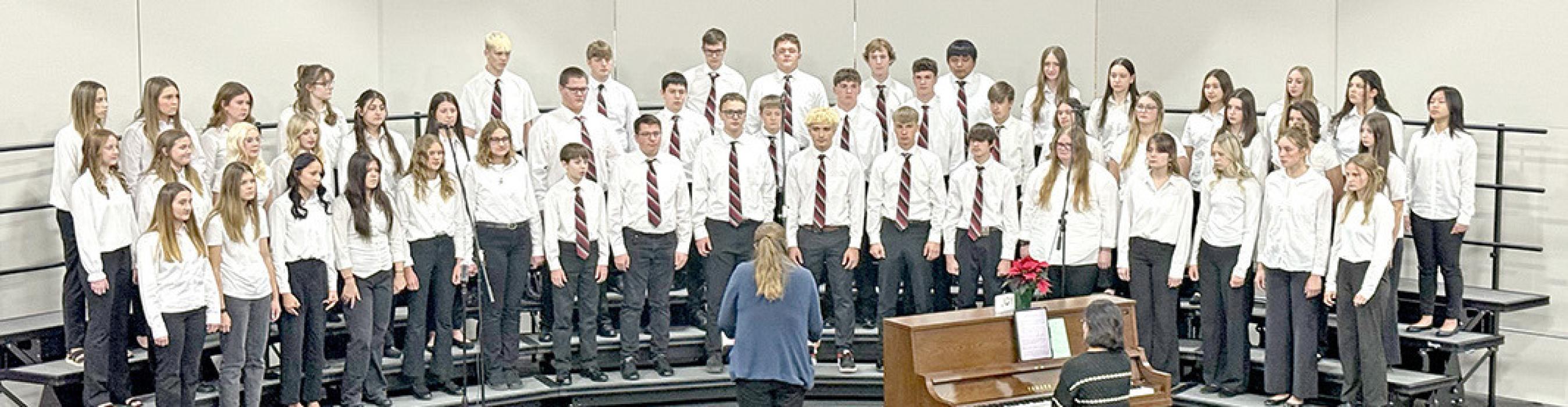 The high school choir performed Tidings of Comfort and Joy, December in My Hometown, and We Three Kings. (Photo by JMe Braun)