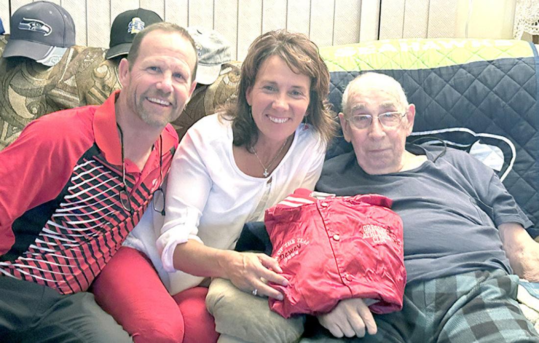Kurt and Kellie Stukel of the Gregory Athletics Club presented Dewey Allum with a Gregory Gorillas jacket for being named Fan of the Year. Allum was unable to attend Coronation, where the Fan of the Year announcement is usually made, due to health reasons.