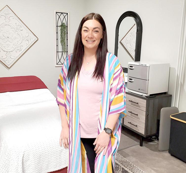 Britnie Kenzy is shown here in her newly opened therapeutic massage business, Corrective Connections Massage &amp; Therapeutics, located in the back of the 621 Main building.