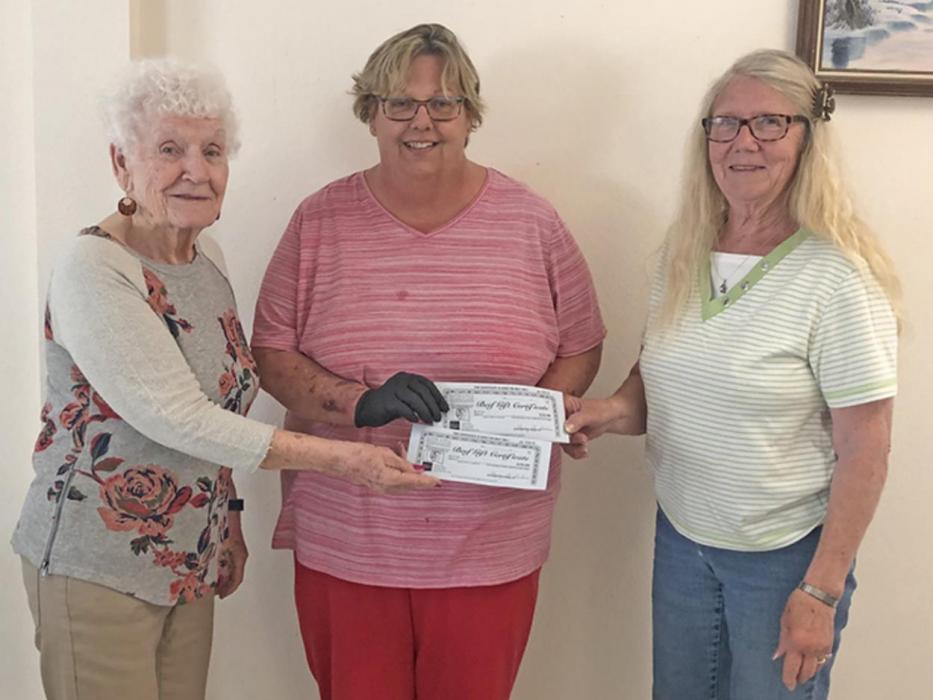 Deanna Nelson, right, representing the Rosebud Rancherettes, donated beef certificates to Linda Bartling and Sylvia Mikkelsen, representing the Gregory Senior Meals.