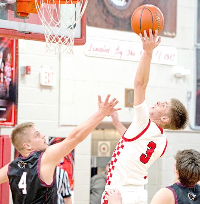 During the hard fought battle against Platte-Geddes, Lincoln Juracek led the charge with 17 points. (Photo by Melissa Bearshield)