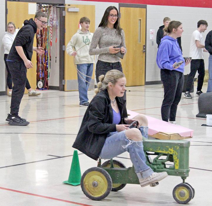 Senior Aubree Opp negotiates the John Deere tractor course. (Photos by Charissa Ring)
