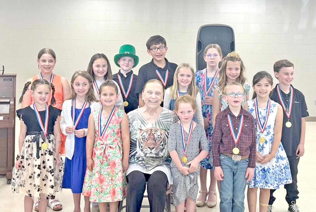 Mary Beth Gergen, center front, hosted a recital with her latest class of piano students this spring. She has been giving piano lessons since she was 14 years old.