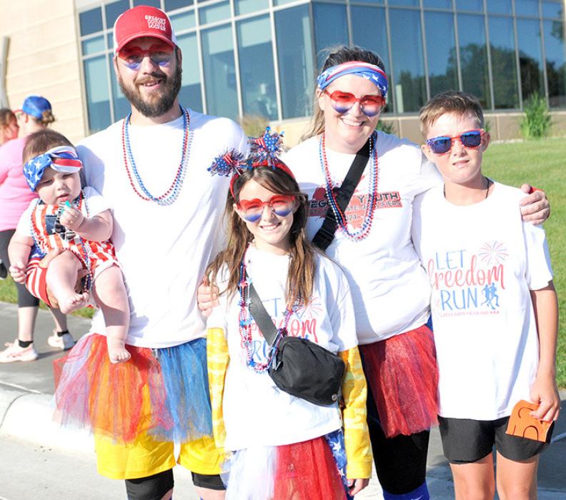 Chris Petersen, baby Frankie, Catie, Hailie, and AJ Lutt, earned the most festive dressed participants for the event.