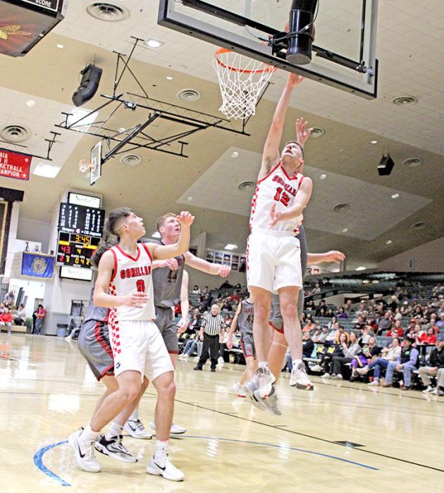 Cole Serr goes up for two in Gregory’s postseason win against Corsica-Stickney at the Corn Palace on Saturday. (Photo by Sara Anderson)