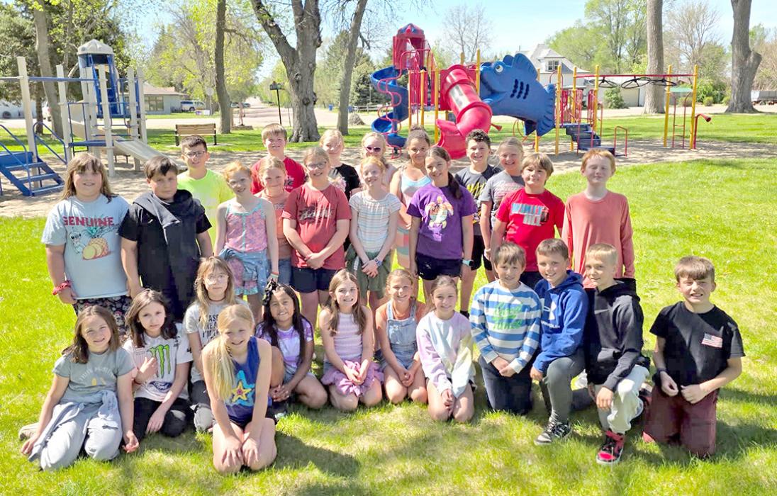 The 4th grade students picked up sticks and trash at the park.