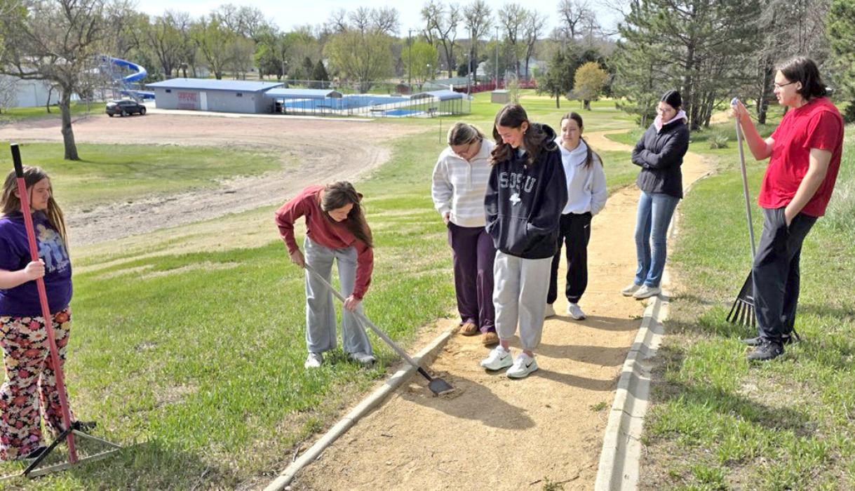 Walkers and fitness enthusiasts won’t have to worry about twisted ankles thanks to the Juniors who smoothed out the walking path at the park.