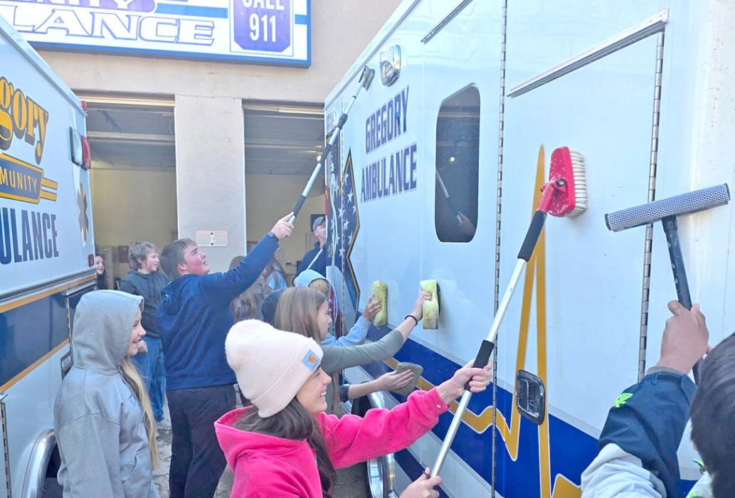 Chilly temperatures didn’t deter the 6th grade class from helping wash the ambulances and police cars.