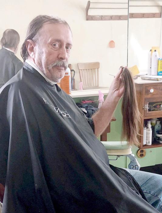 Leroy Creekmur said it was time to cut his hair, so he went to The Bull Shop in Gregory and had Jorgan Remme cut 18 inches off. Women aren’t the only ones who can donate to the Locks of Love program.