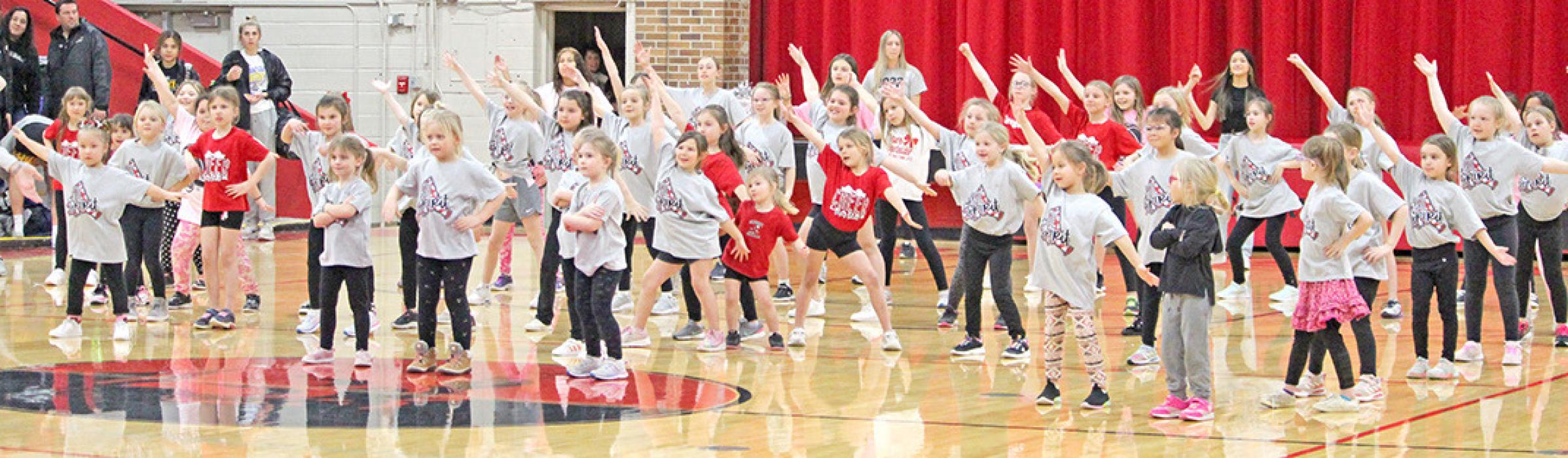 Future cheerleaders perform after girls basketball game