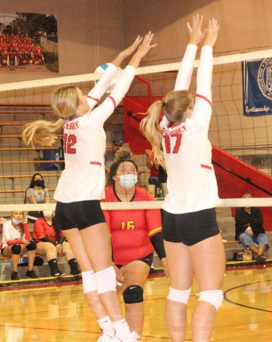 Brooklynn Kenzy (#12) and Kodi Timanus (#17) go up for a block in Gregory's win over St. Francis earlier this season.
