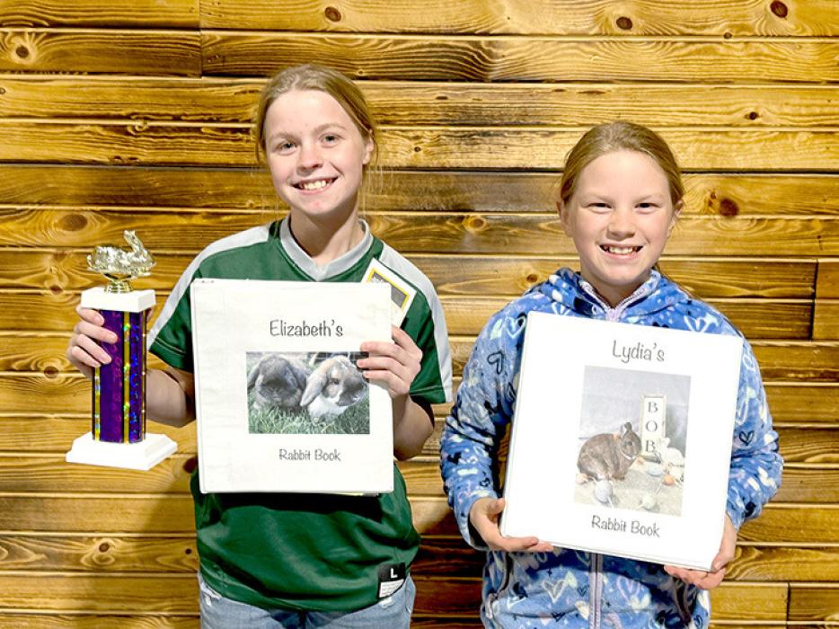 At the SDRBA show in Rapid City, Elizabeth, right, was top youth point earner and first overall in the Junior Royalty contest, which included her show records, an essay about her accomplishments and goals, a general test, breed identification, and a showmanship contest. Lydia, left, was first overall in the royalty contest for beginners.