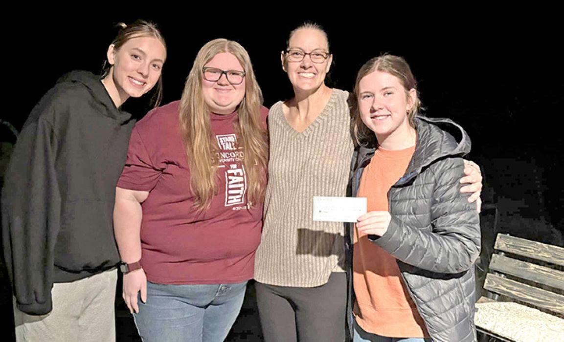 Seniors Asia VanDerWerff, Dani Timanus, and Riki Bruns designated $500 of their winter formal proceeds to Suzanne Braun. The trio hoped the donation would help defray her medical expenses and show the community’s support during her time of need.