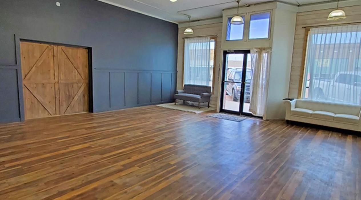 The photography studio is the first room as you enter the building. Sliding doors to the party room can be opened for larger groups to overflow into the studio space.