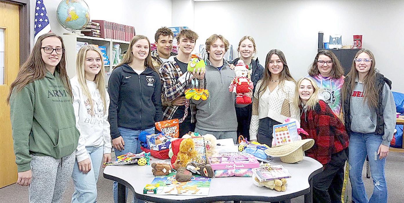 Members of the Gregory Honor Society assisted the elementary students with picking out gifts for their family and friends, and then wrapping the presents.