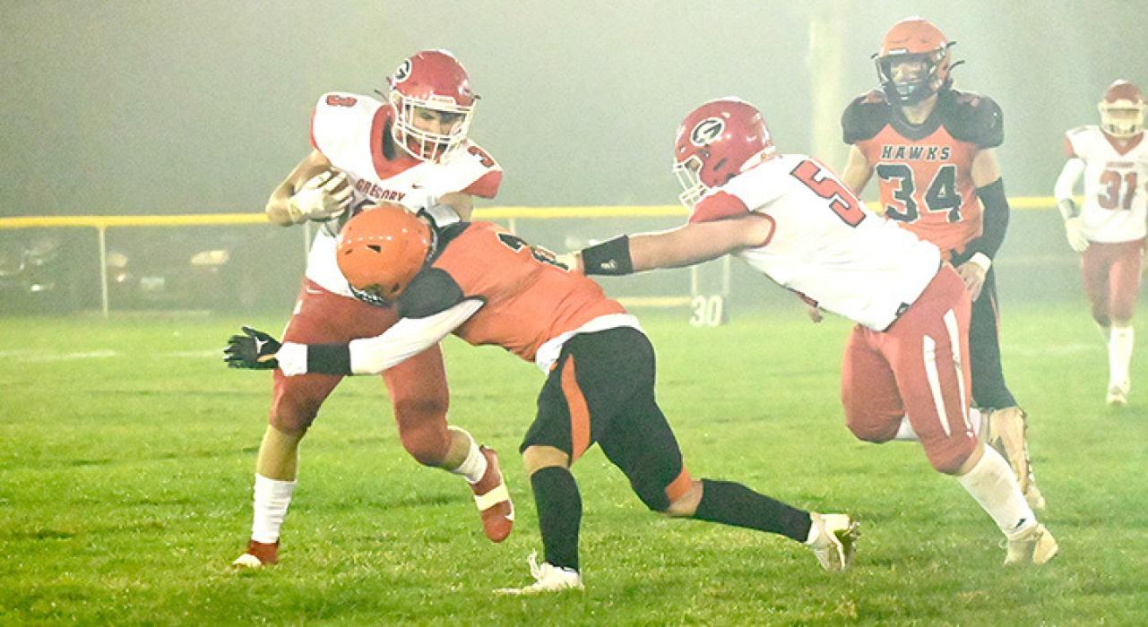 Gannon Thomas carries the ball as Nathan Fortuna tries to help out in Canistota last Thursday evening. (Photo by Trey Kaul/605 Sports)