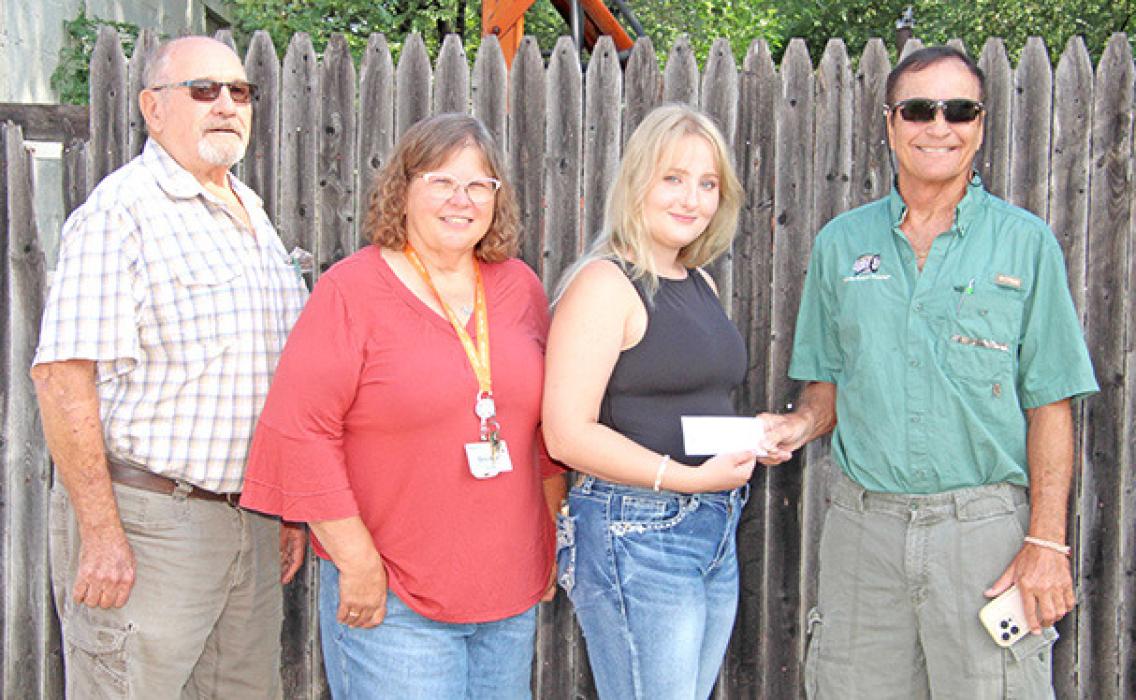 Each year Dallas Cares awards a $1,000 scholarship to a high school senior for volunteer work performed. Dallas Cares representatives Jack Jacobsen, Brenda Lane, and Jack Gunvordahl (far right) presented the scholarship to this year’s recipient, Alyssa Galbraith (second from right).