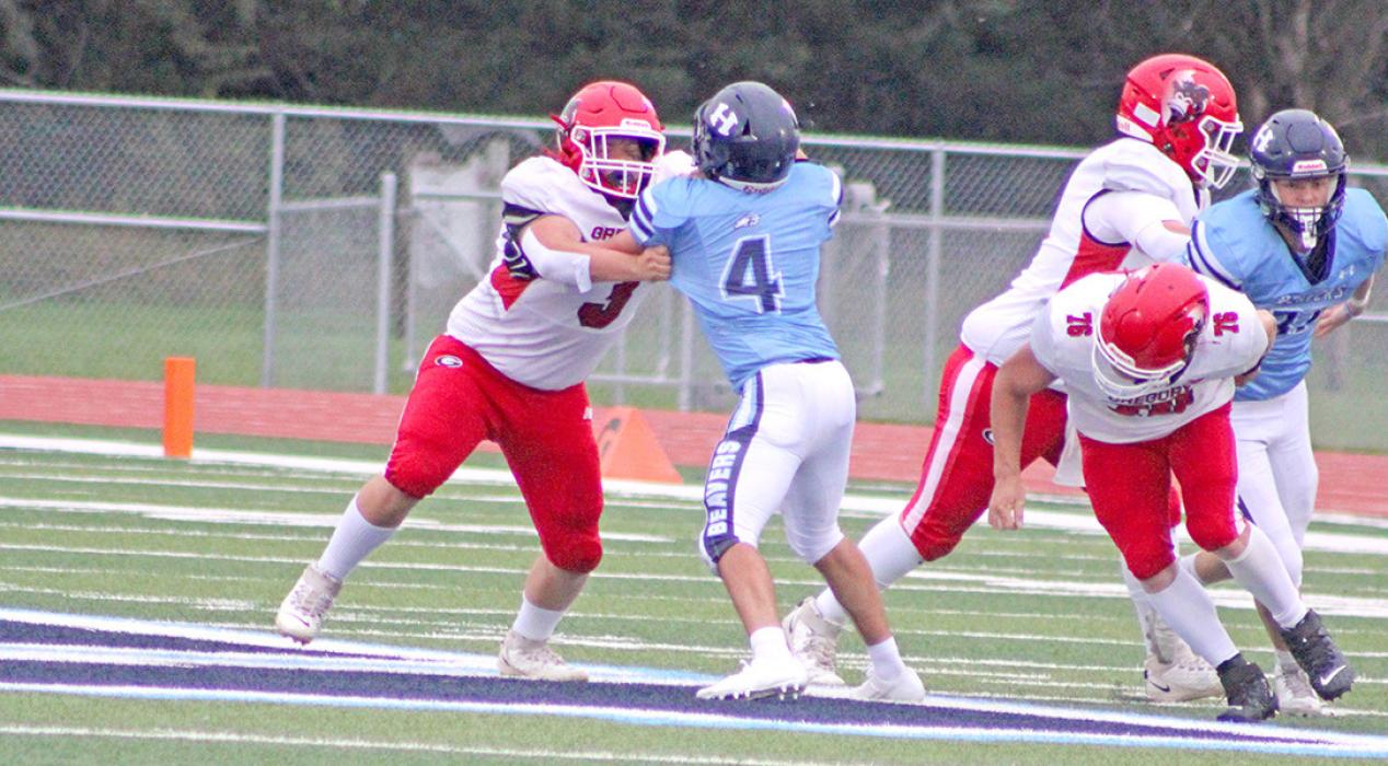 #3 Max Bearshield, #76 Dale Smikle, and another Gorilla player mix it up with a couple Hansen players. (Photo by Maya Hull)