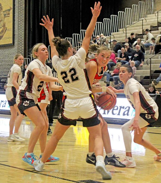 Asia VanDerWerff grits her teeth as she struggles to fight her way through Wagner defenders. (Photo by Regan Graesser, Maya Hull, and Madisan Graber)
