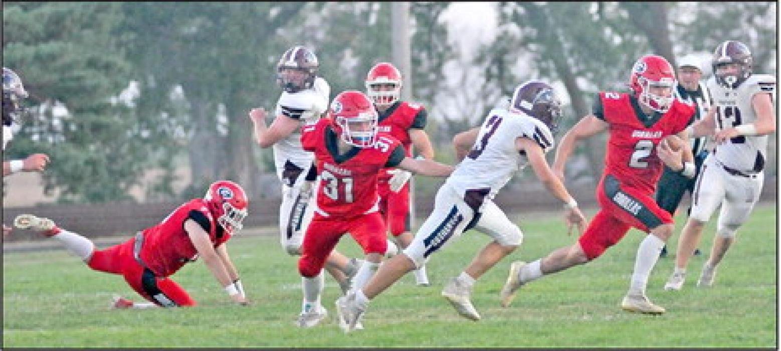 Rylan Peck carries the ball as Landon Keiser tries to stop a Black Panther defender. Peck carried the ball nine times in the game for a total of 24 yards.