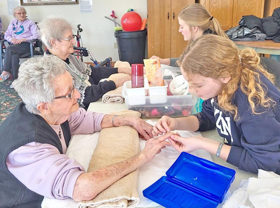 Gregory students visit Silver Threads Assisted Living for activities with residents