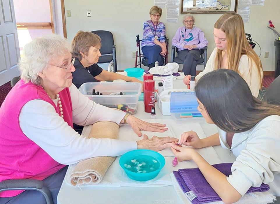 Gregory students visit Silver Threads Assisted Living for activities with residents