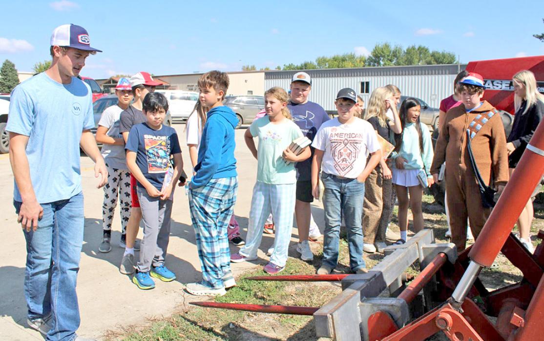 Tyler Kenzy, a junior at GHS, explains safety with a sprayer.