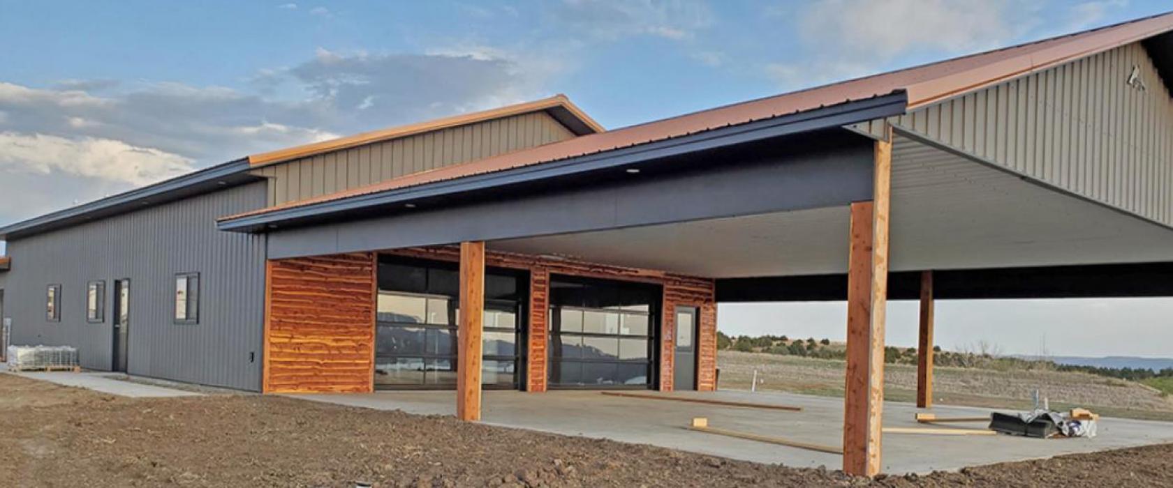 The events center has windowed, garage-style doors that open onto a patio that overlooks the river.