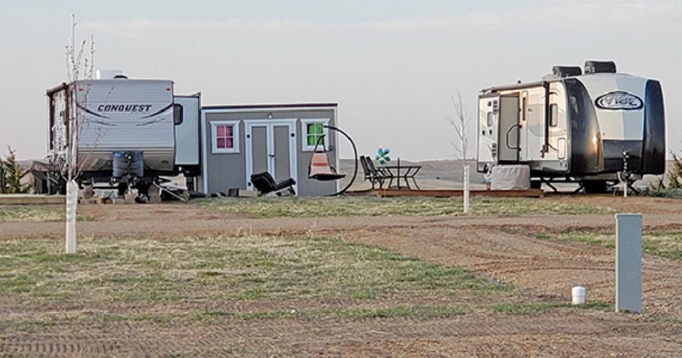 Campers are encouraged to make themselves at home, such as these two campers, who have put in a storage shed and patio area.