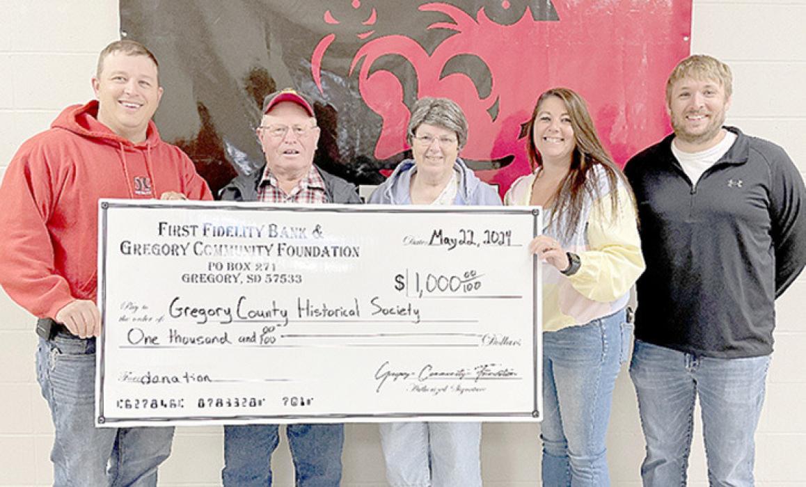 The Gregory Community Foundation presented a grant check for $1,000 to Rich and Bev Rubel, second and third from left, representing the Gregory County Historical Society. The grant is being used to help fund the restoration/ renovation project of the Gregory County Historical Museum that is the former Catholic Church in Dallas. Foundation members presenting the check were l to r: Mark Braun, Aliza Wonnenberg, and Kevin Myrmoe.