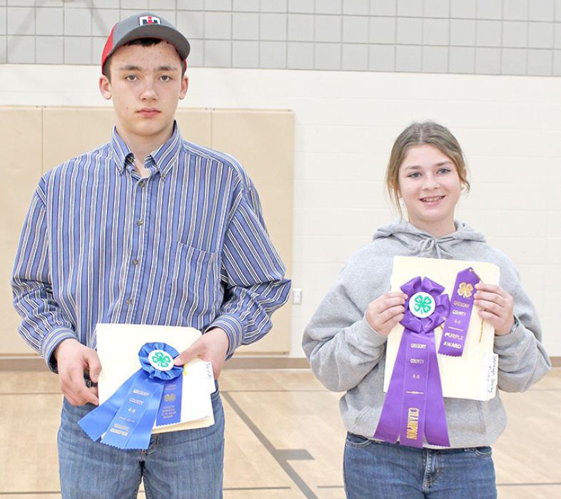 Jack Schulte, left, received a blue, Reserve Champion Junior; and Brooklyn Bailey earned a purple, Grand Champion Junior.
