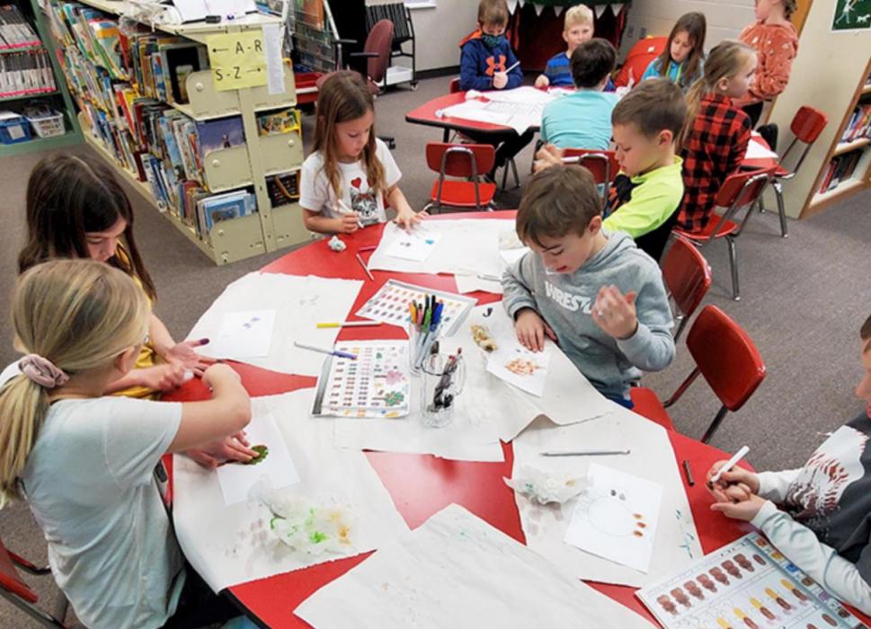 Using washable markers to color their fingers, these second-graders were engrossed in the activity as they created their fingerprint works of art.