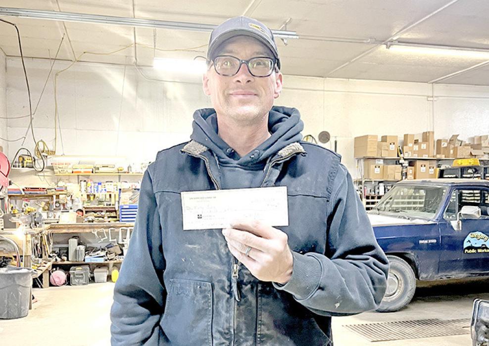 Marty Jung also received a check to help defray some of the costs associated with his health challenges.