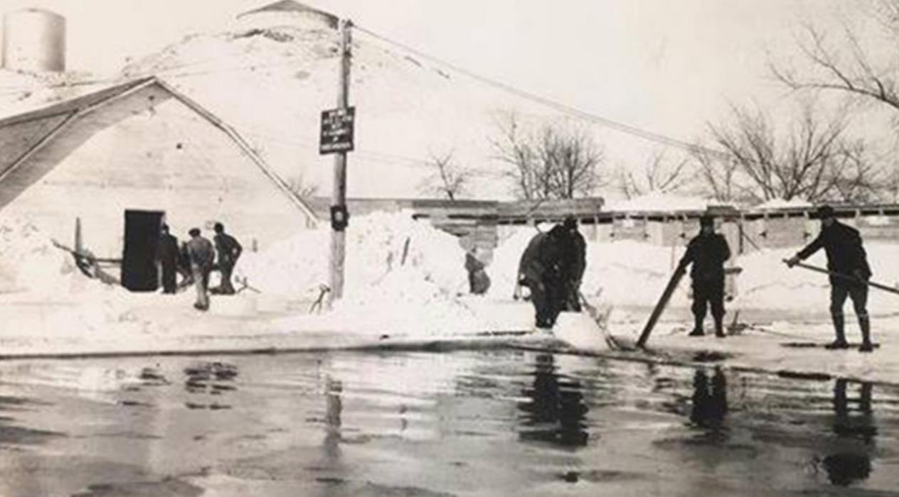 The pool was originally constructed to harvest ice in the winter. The ice was stored in building to the left.